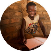 Happy child reading a book