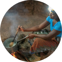 Person cooking with a solar headtorch.
