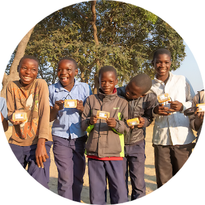 Several happy children holding their solar lights.