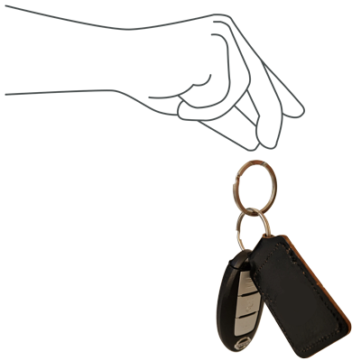 Hand dropping a set of car keys
