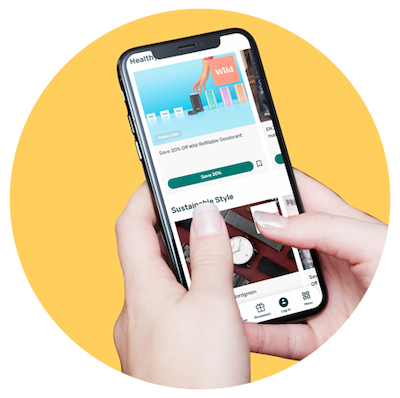 User holding a phone with the The Green Insurer app on a yellow background.