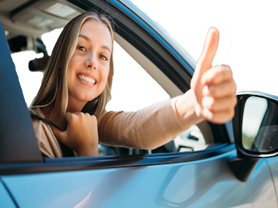 Image of young adult driving, with an illustration outline of the car